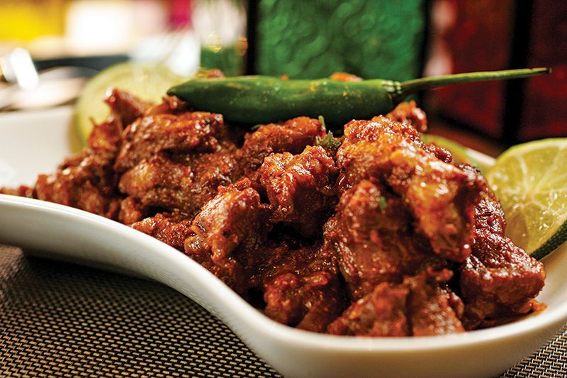 Cabrito em pedaços ao molho de cebola, alho e gengibre Cabrito em pedaços ao molho de cebola, alho e gengibre