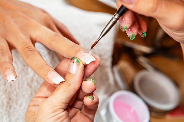 Nail art – applying gels and colors in nail studio