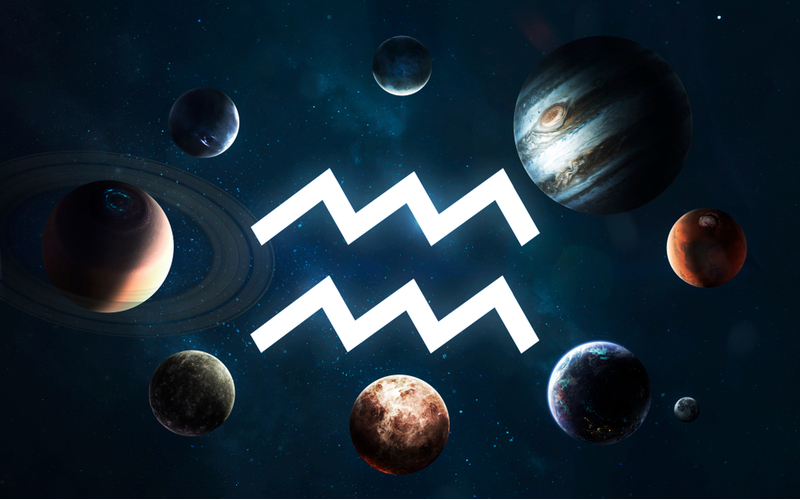 Símbolo de aquário no centro e diversos planetas em volta