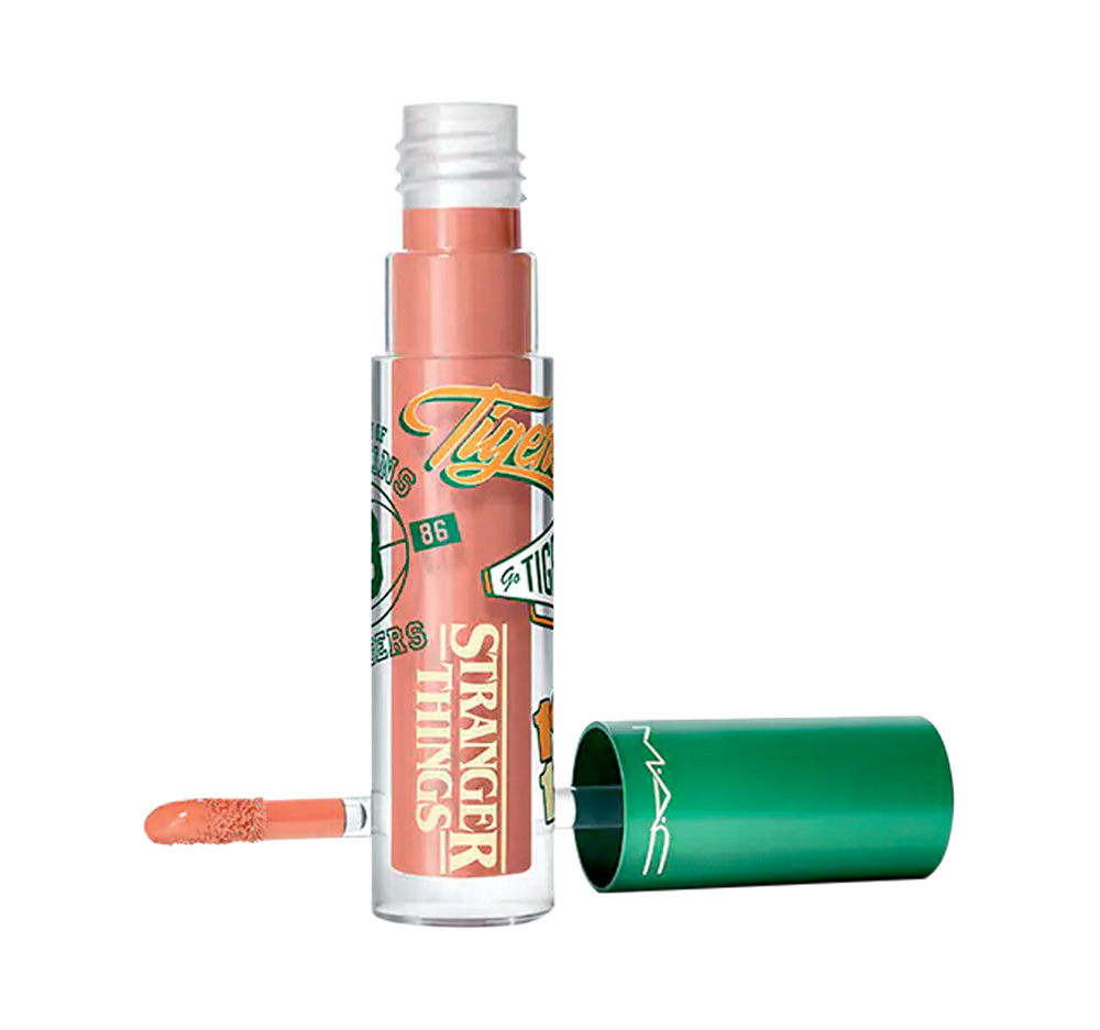 Gloss rosa em frasco cil&iacute;ndrico transparente com tampa verde. Tem logos da quarta temporada de Stranger Things na parte transparente