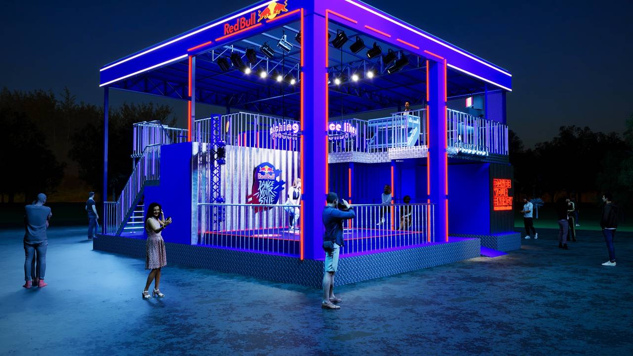 Pop-up em formato de cubo destaca letreiro Red Bull e tem cores roxas.