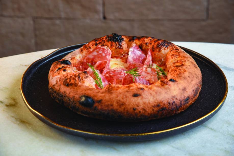 Pizza finocchiona: opção da Trattorita Evvai Pizza finocchiona: opção da Trattorita Evvai